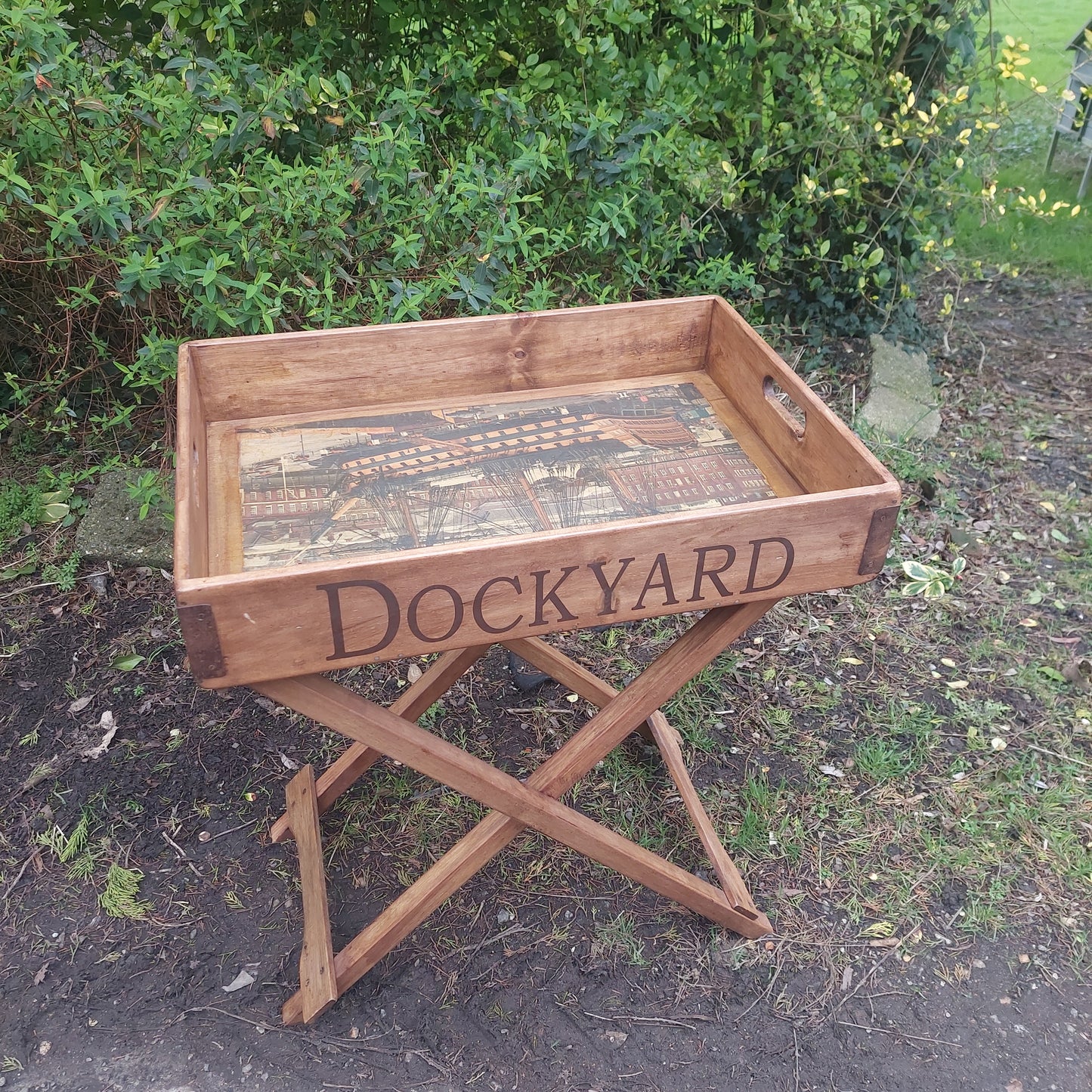 Solid wood butler tray on a fold away stand HMS Victory print